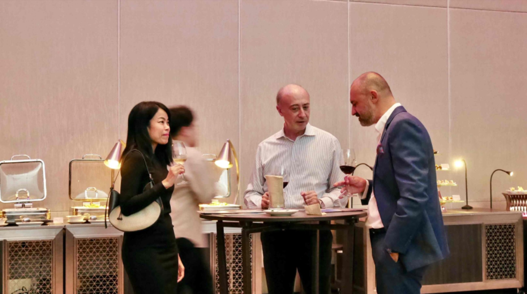 Two guests in conversation at a table